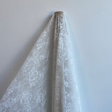Ivory Floral Lace — featuring scalloped edges, eyelash detail and floral motifs, in nylon, 150cm wide