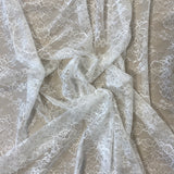Ivory Floral Lace — featuring scalloped edges, eyelash detail and floral motifs, in nylon, 150cm wide