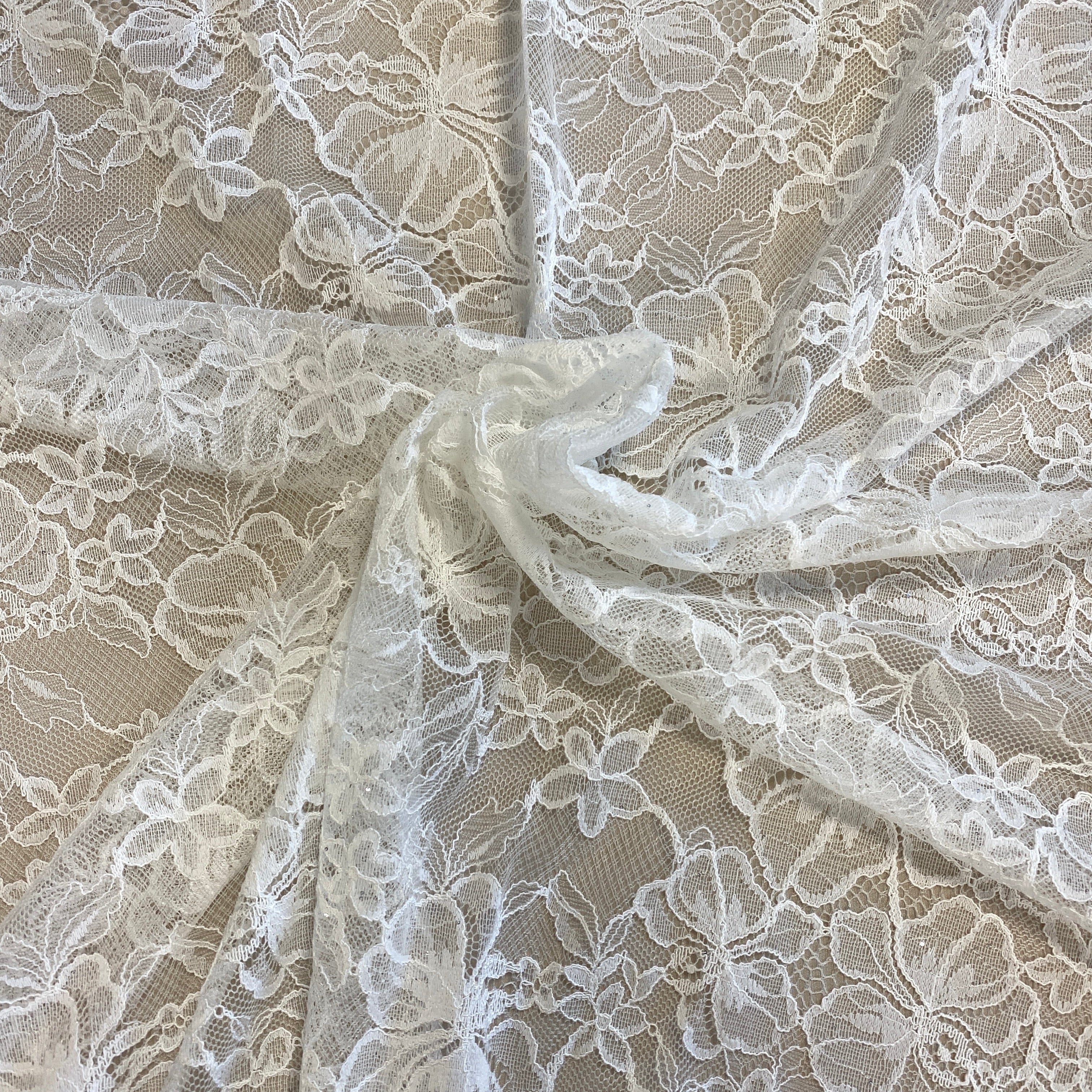 Ivory Glitter Floral Lace — featuring scalloped edges and floral motifs, in nylon, 140cm wide