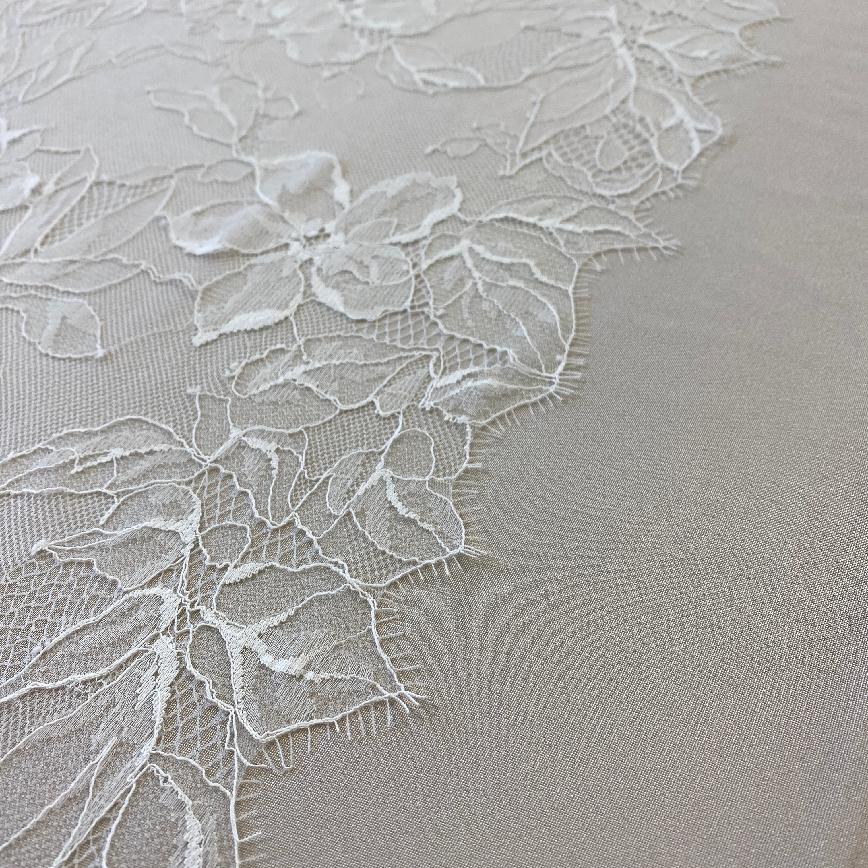 Ivory Floral Lace — featuring scalloped edges, eyelash detail and floral motifs, in nylon, 140cm wide