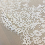 Ivory Floral Lace — featuring scalloped edges, eyelash detail and floral motifs, in nylon, 150cm wide