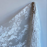 Ivory Floral Lace — featuring scalloped edges, eyelash detail and floral motifs, in nylon, 150cm wide