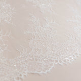 Ivory Beaded Lace — featuring scalloped edges, floral motifs and hand-beading, in nylon and viscose, 130cm wide