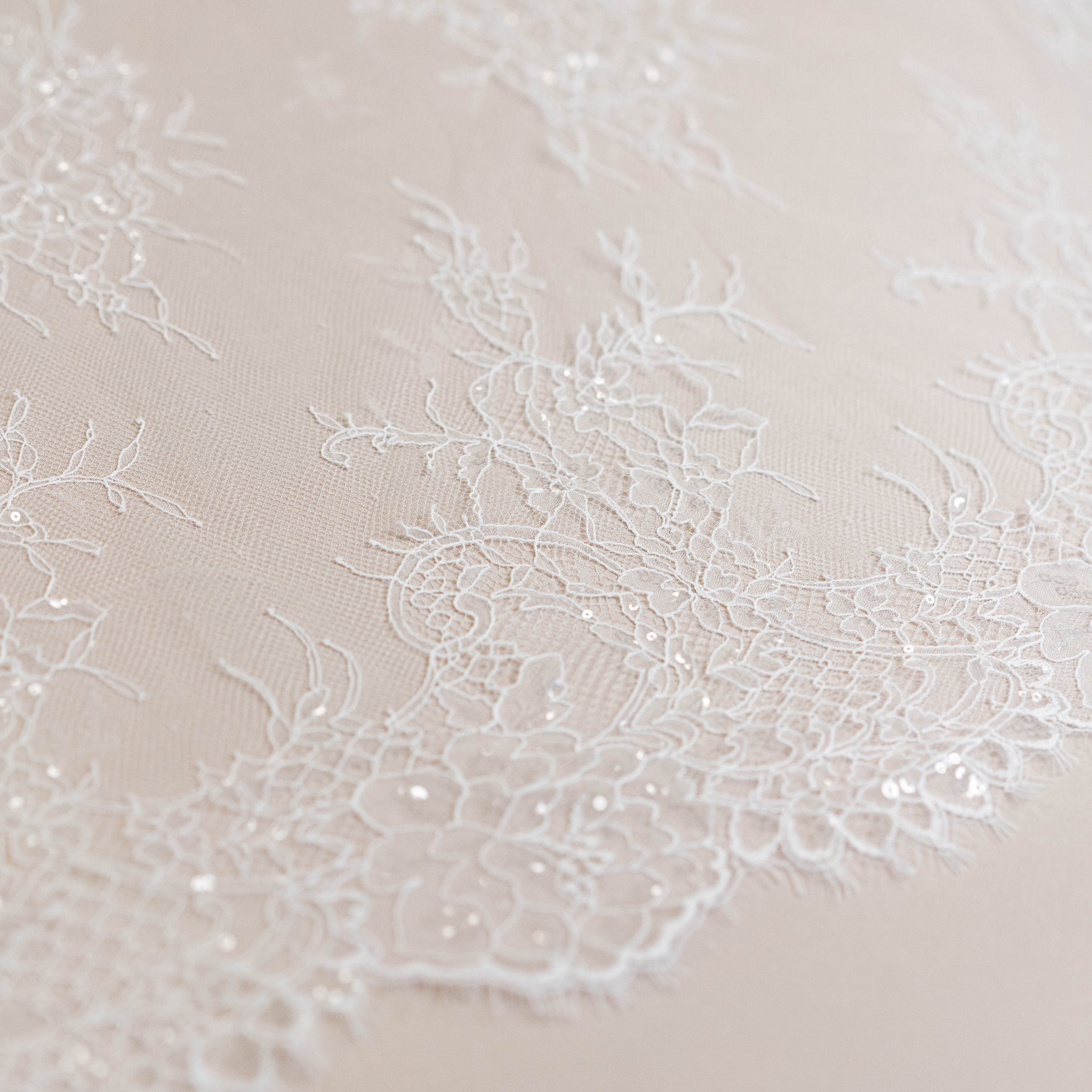 Ivory Beaded Lace — featuring scalloped edges, floral motifs and hand-beading, in nylon and viscose, 130cm wide