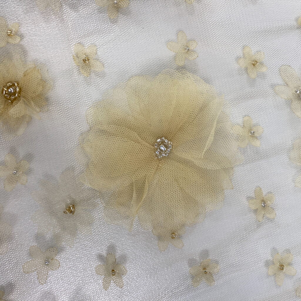 Butter Embellished 3D Tulle — featuring floral motifs, a 3D floral design and hand-beading, 100% nylon, 140cm wide