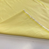 Pastel Yellow Polyester Dupion — mid-weight and crisp with a lightly slubbed texture, 100% polyester, 140cm wide