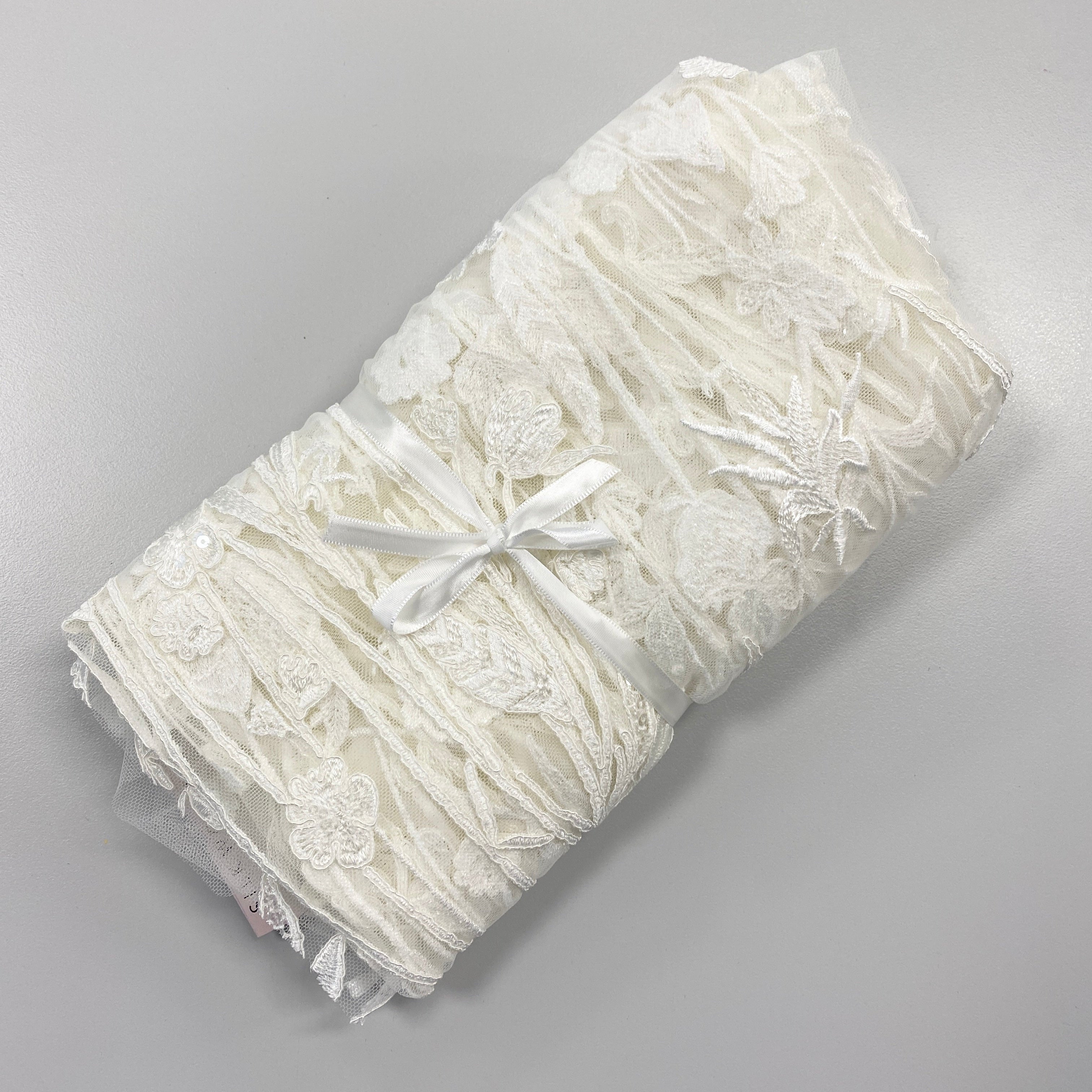 Ivory Embroidered Floral Tulle — featuring floral motifs and sequins, 50% nylon 50% rayon, 130cm wide
