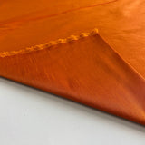 Burnt Orange Polyester Dupion — mid-weight and crisp with a lightly slubbed texture, 100% polyester, 140cm wide