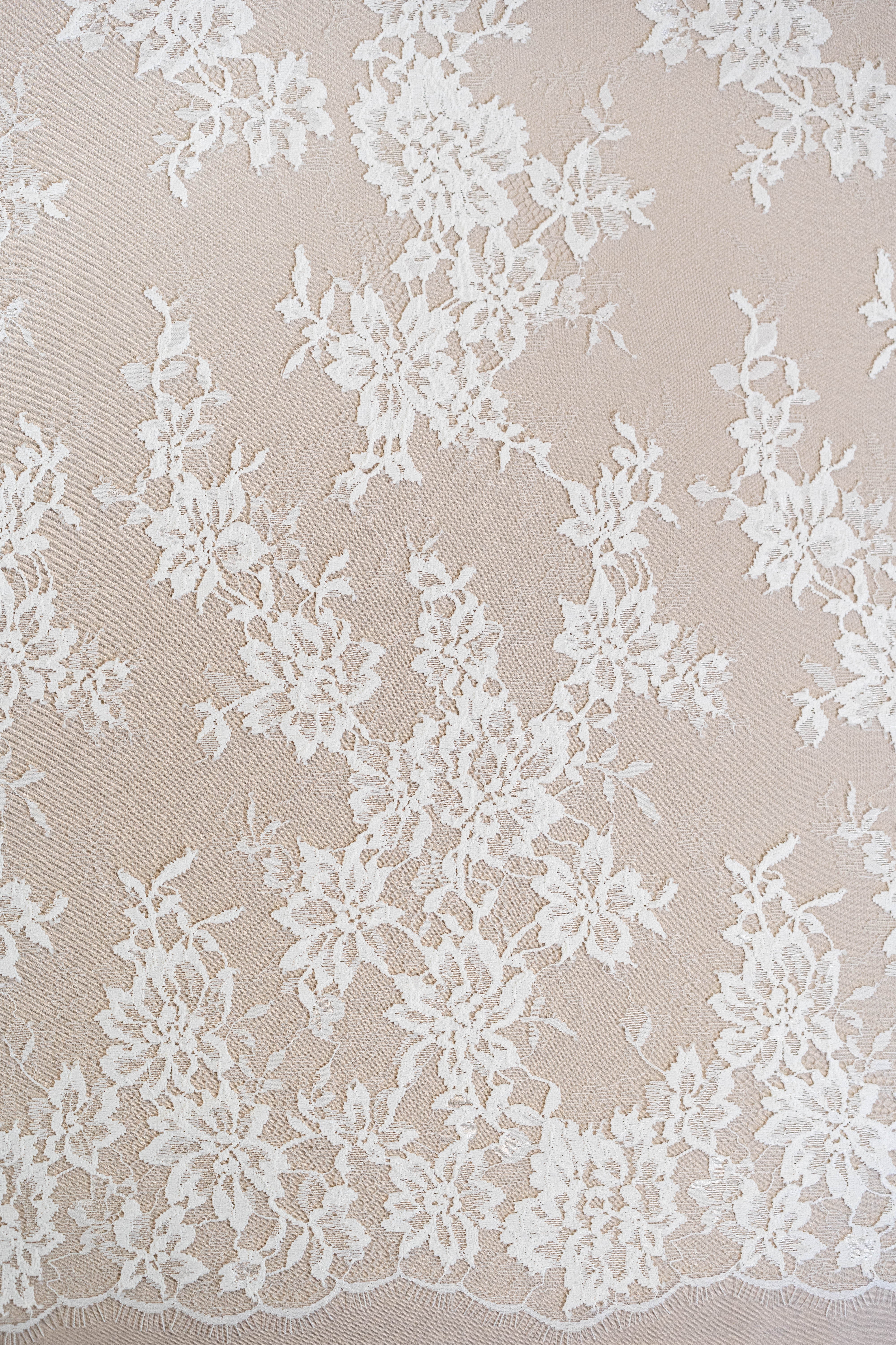 Ivory Fine Floral Lace — featuring scalloped edges, eyelash detail and floral motifs, in nylon, 130cm wide