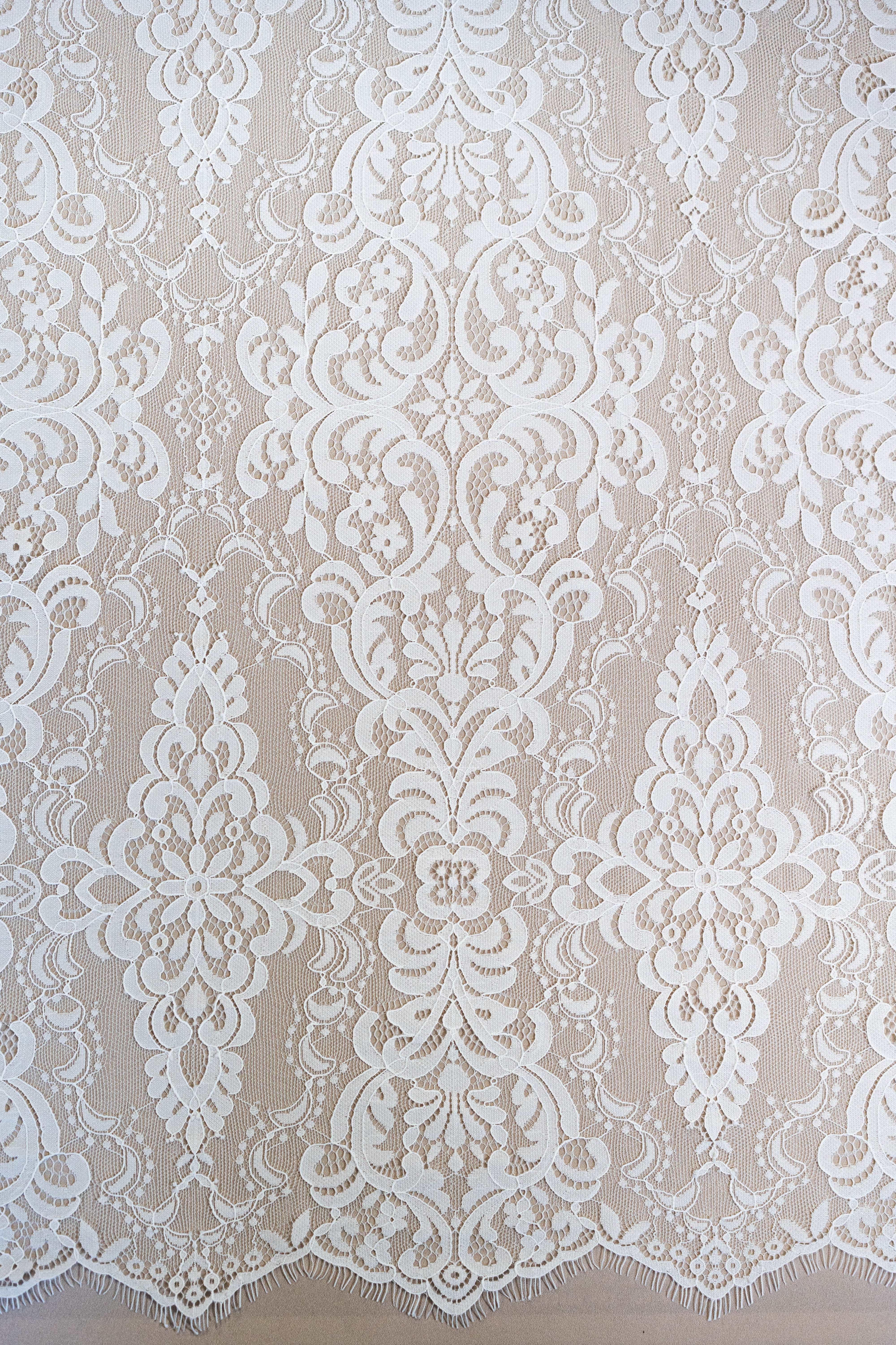 Light Ivory Corded Fine Lace — featuring scalloped edges, eyelash detail, arabesque motifs and a corded texture, 130cm wide