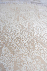 Light Ivory Corded Fine Lace — featuring scalloped edges, eyelash detail, arabesque motifs and a corded texture, 130cm wide