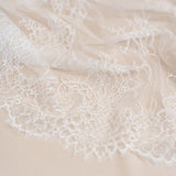 Ivory Beaded Lace — featuring scalloped edges, floral motifs and hand-beading, in nylon and viscose, 130cm wide