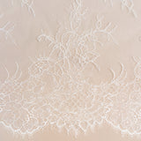 Ivory Beaded Lace — featuring scalloped edges, floral motifs and hand-beading, in nylon and viscose, 130cm wide