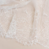 Ivory Beaded Lace — featuring scalloped edges, floral motifs and hand-beading, in nylon and viscose, 130cm wide