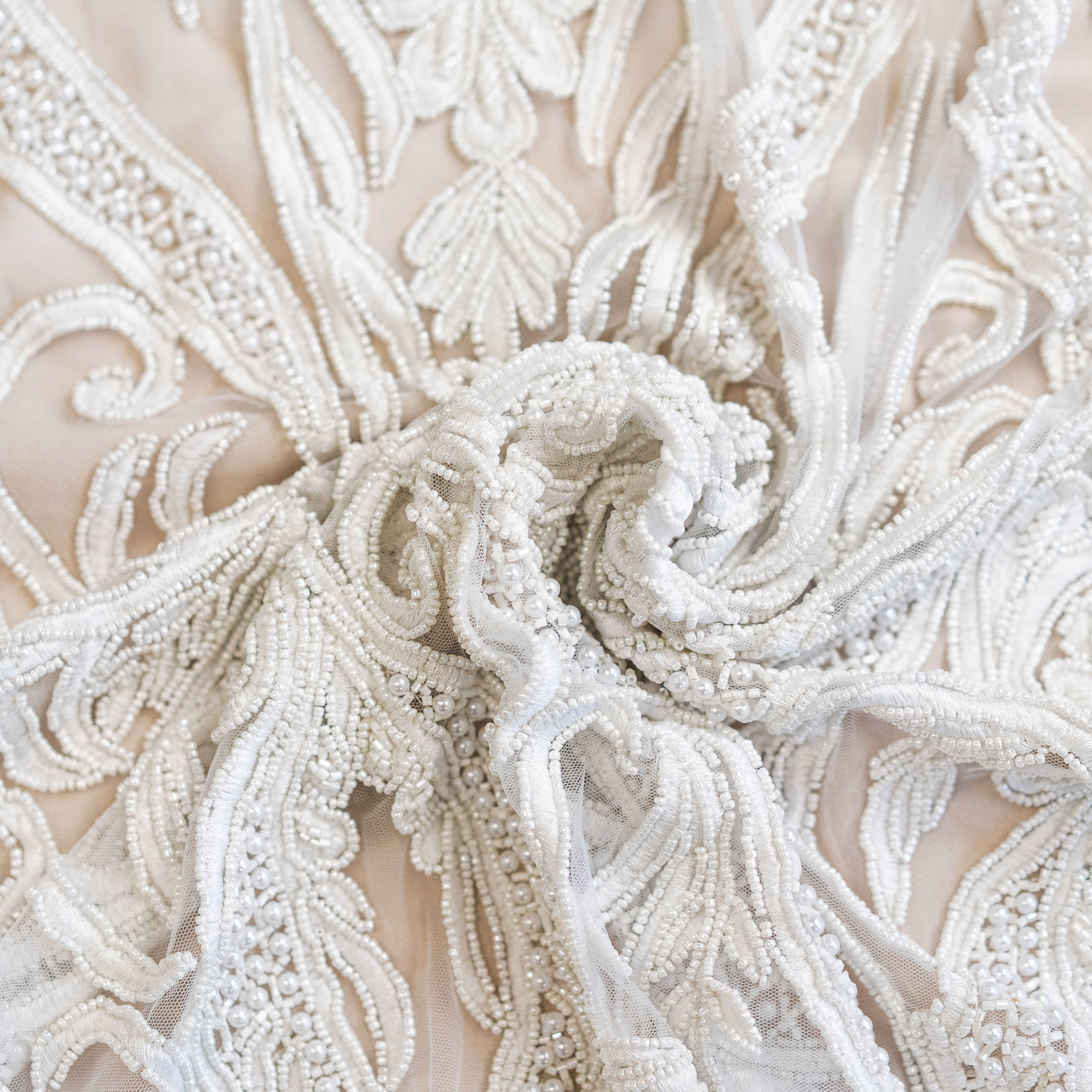 Ivory Beaded Tulle — featuring hand-beading, 100% nylon, 130cm wide