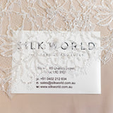 Light Ivory Floriated Beaded Lace Trim — featuring scalloped edges, eyelash detail and floral motifs, in nylon, 30cm wide