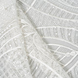 Ivory Embellished Tulle — featuring scalloped edges and hand-beading, 50% nylon 50% rayon, 130cm wide