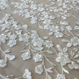 Ivory / Silver Embellished Floral Tulle — featuring floral motifs, hand-beading and sequins, 60% rayon 40% nylon, 140cm wide