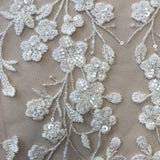 Ivory / Silver Embellished Floral Tulle — featuring floral motifs, hand-beading and sequins, 60% rayon 40% nylon, 140cm wide