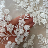 Ivory / Silver Embellished Floral Tulle — featuring floral motifs, hand-beading and sequins, 60% rayon 40% nylon, 140cm wide