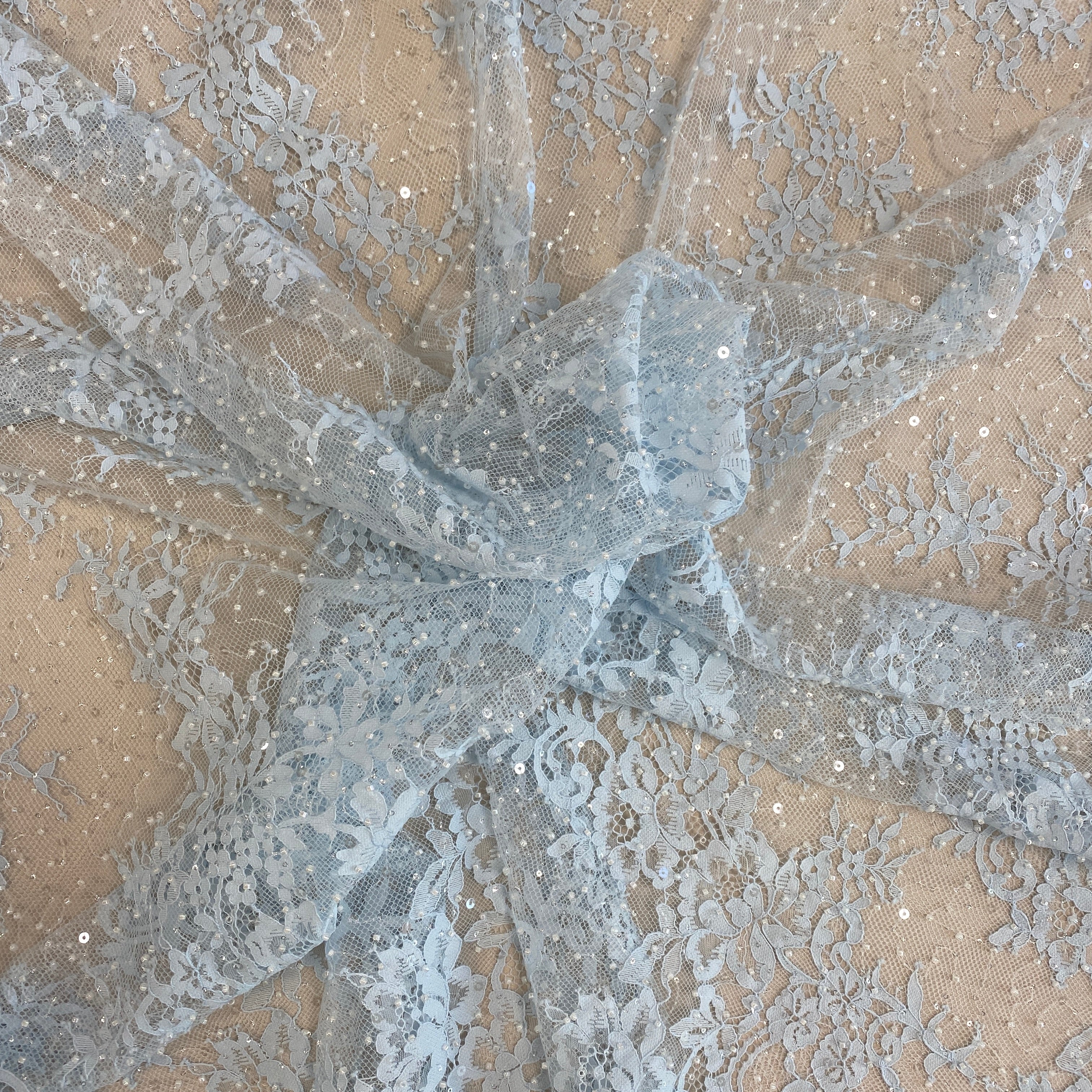 Baby Blue Beaded Fine Lace — featuring scalloped edges, eyelash detail and floral motifs, in nylon and viscose, 130cm wide
