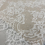 Ivory Beaded Fine Lace — featuring scalloped edges, eyelash detail and floral motifs, in nylon and viscose, 130cm wide