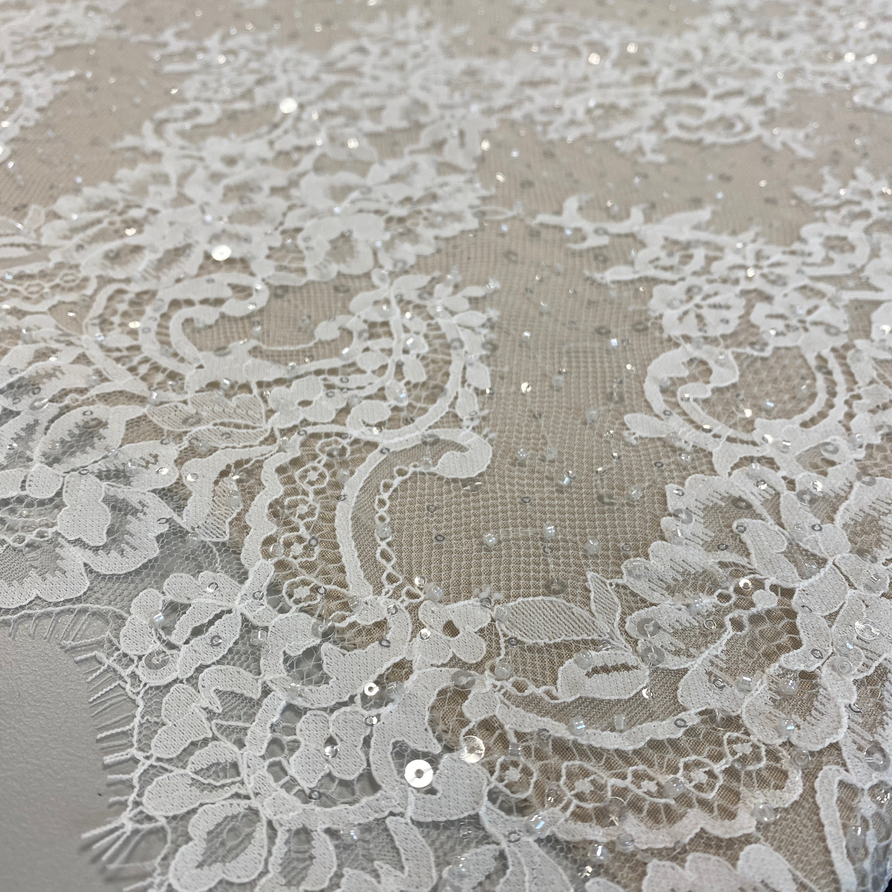 Ivory Beaded Fine Lace — featuring scalloped edges, eyelash detail and floral motifs, in nylon and viscose, 130cm wide