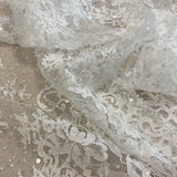 Ivory Beaded Fine Lace — featuring scalloped edges, eyelash detail and floral motifs, in nylon and viscose, 130cm wide