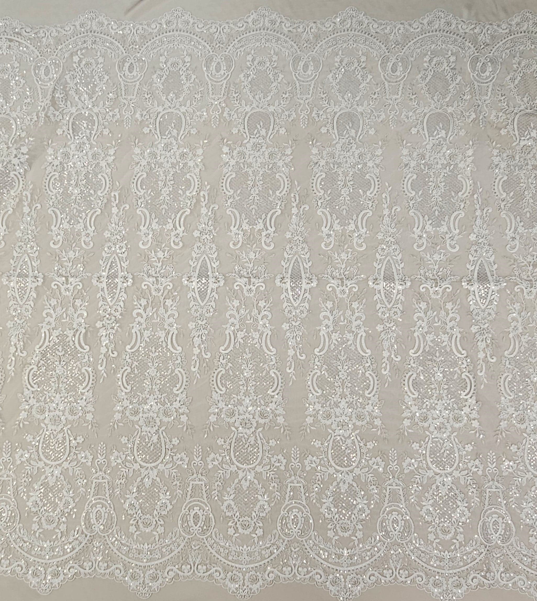 Ivory / Silver Embroidered Corded Tulle — featuring scalloped edges, a corded texture and sequins, 50% nylon 50% rayon, 130cm wide