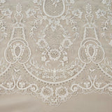Ivory / Silver Embroidered Corded Tulle — featuring scalloped edges, a corded texture and sequins, 50% nylon 50% rayon, 130cm wide