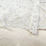 Ivory / Silver Embroidered Corded Tulle — featuring scalloped edges, a corded texture and sequins, 50% nylon 50% rayon, 130cm wide