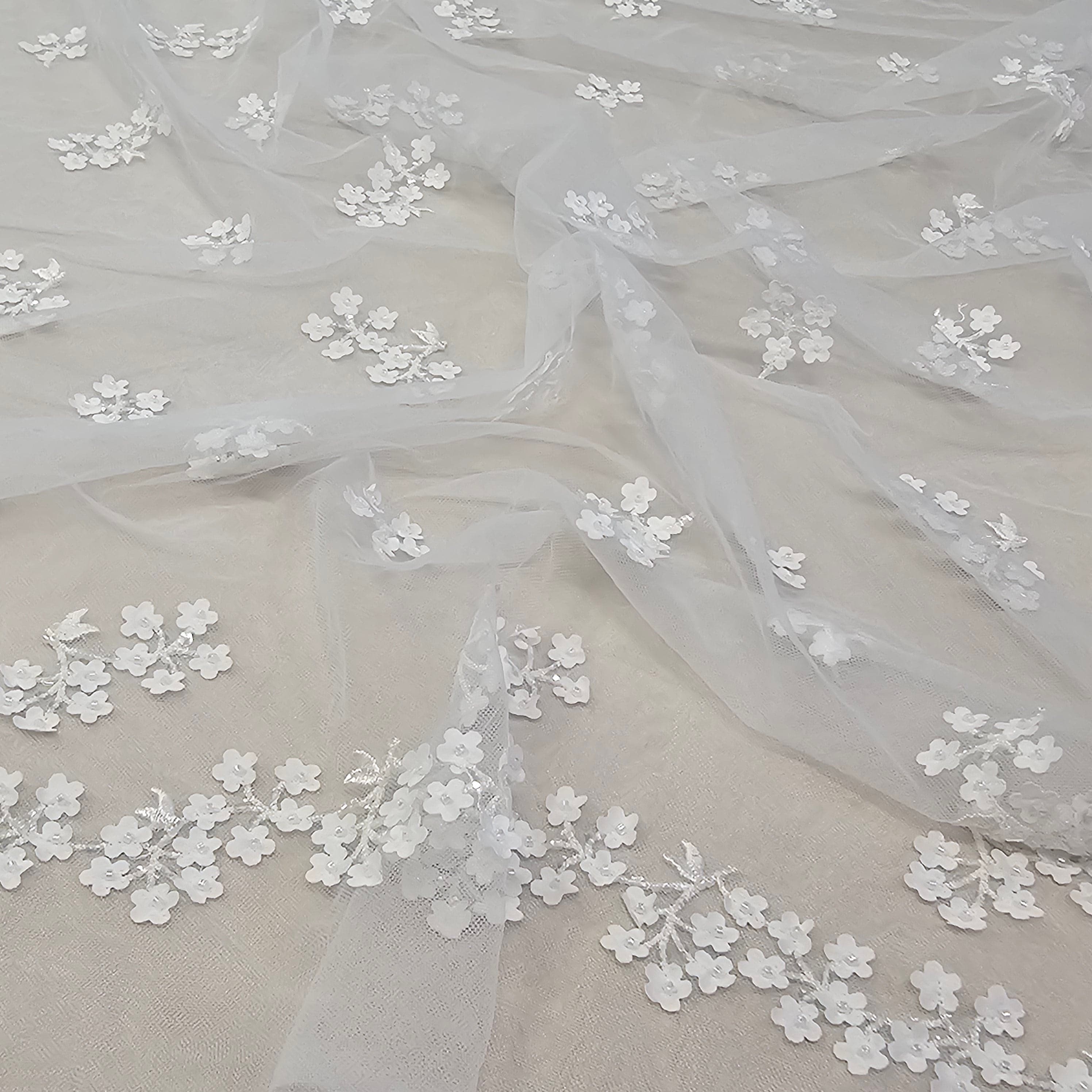 Ivory 3D Floral Tulle — featuring floral motifs, a 3D floral design and a border design, 50% nylon 50% rayon, 130cm wide