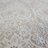 Ivory Fine Floral Lace — featuring scalloped edges, eyelash detail and floral motifs, 130cm wide