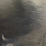 Black Liquid Satin — smooth and glossy with a liquid, wet-look shimmer, 100% polyester, 150cm wide