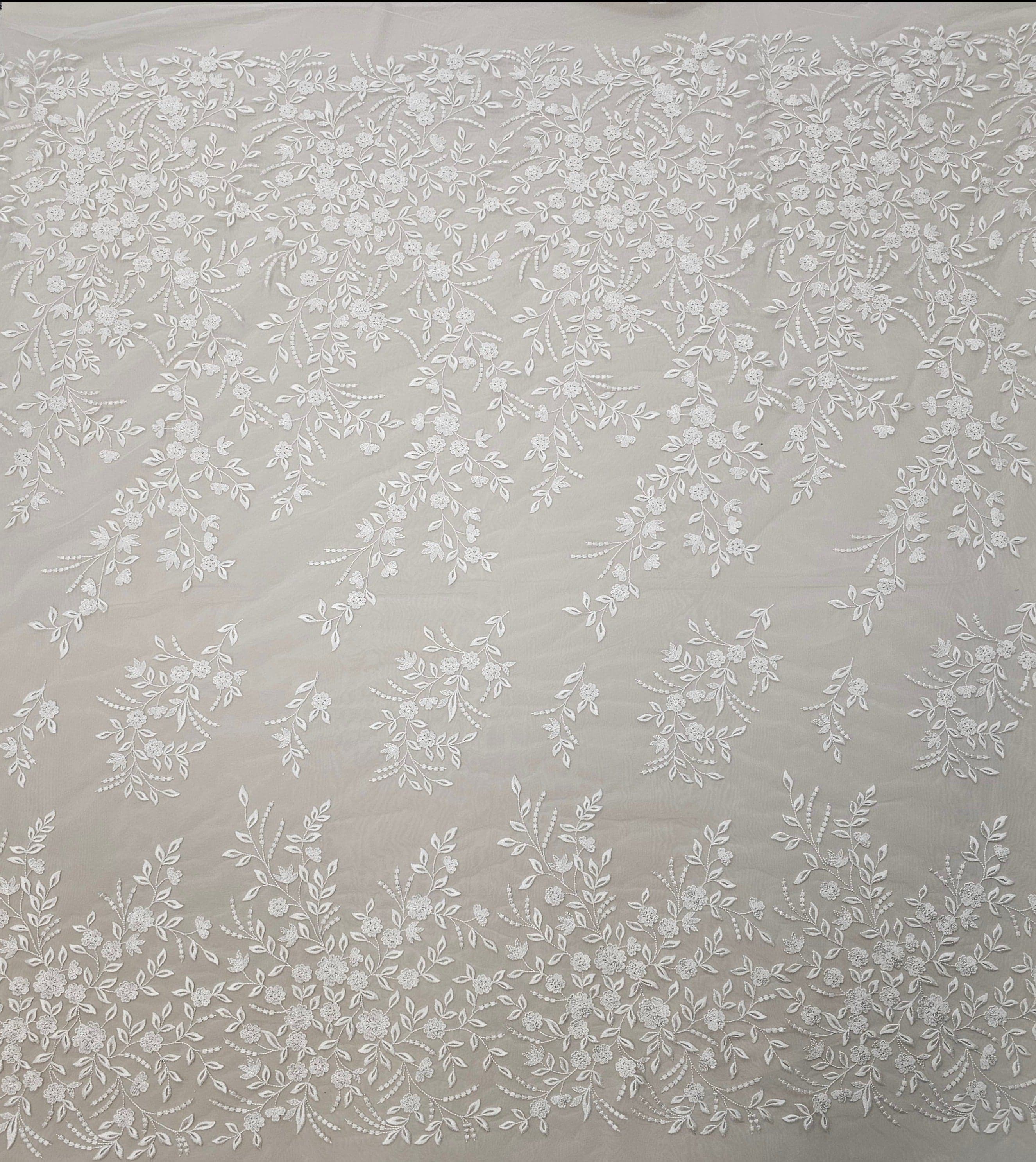 Ivory Embroidered Tulle — featuring a border design, 50% nylon 50% rayon, 135cm wide