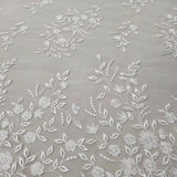 Ivory Embroidered Tulle — featuring a border design, 50% nylon 50% rayon, 135cm wide