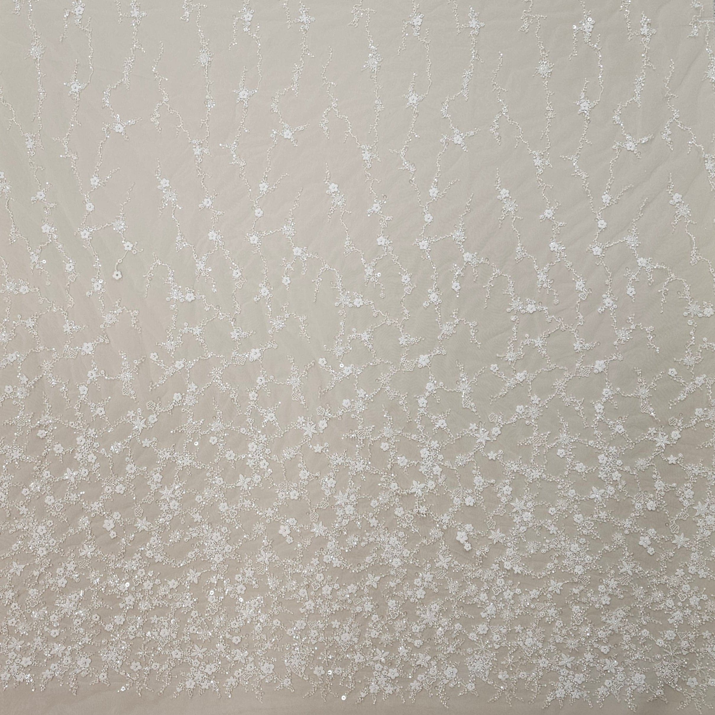 Ivory Sequined Tulle — featuring floral motifs, hand-beading and sequins, 60% rayon 40% nylon, 140cm wide