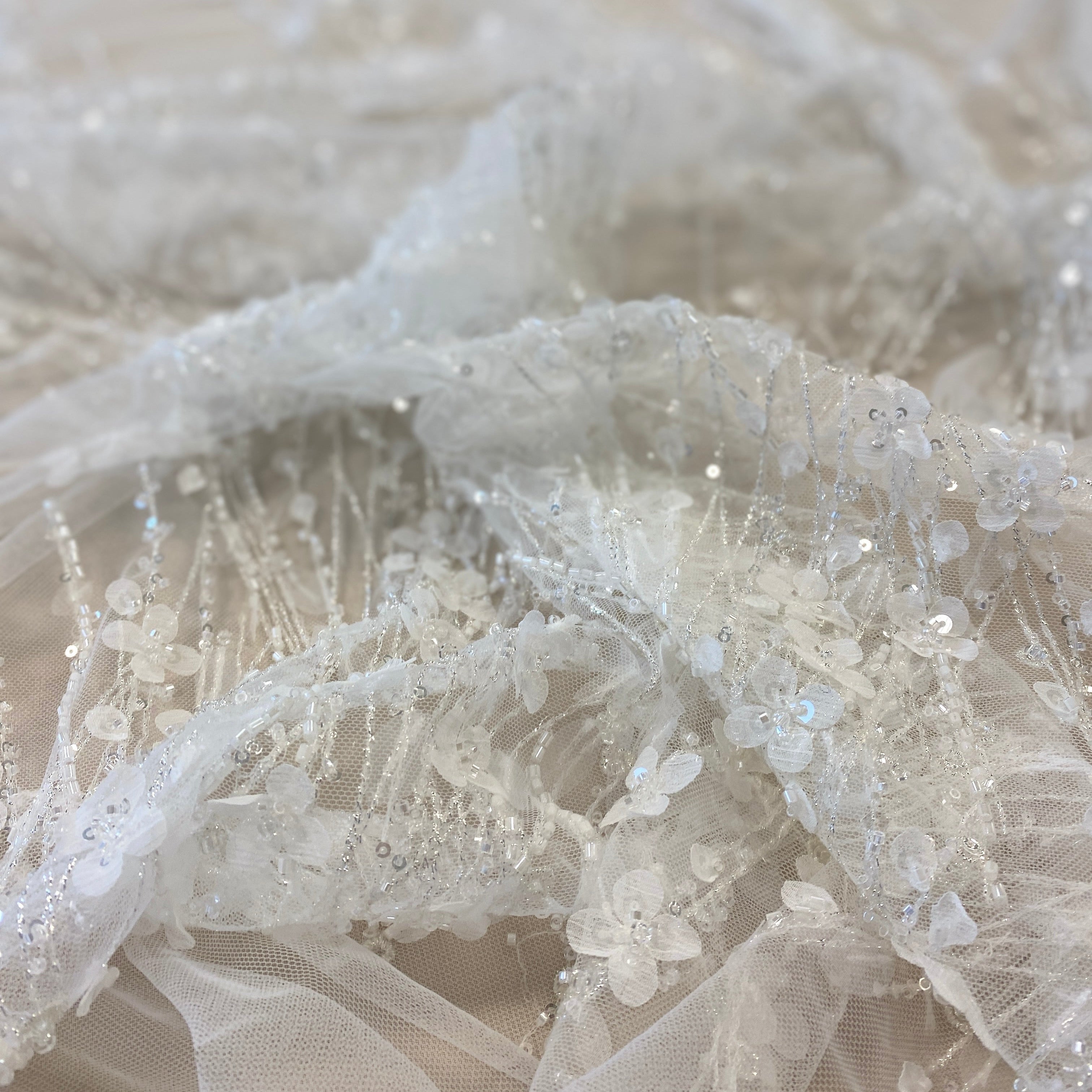 Ivory / Silver 3D Floral Blossom Embroidered Tulle — featuring floral motifs, a 3D floral design and hand-beading, 60% rayon 40% nylon, 140cm wide