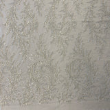 Ivory / Silver Embellished Tulle — featuring a leaf design and hand-beading, 60% rayon 40% nylon, 140cm wide