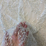 Ivory / Silver Embellished Tulle — featuring a leaf design and hand-beading, 60% rayon 40% nylon, 140cm wide