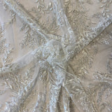 Ivory / Silver Embellished Tulle — featuring a leaf design and hand-beading, 60% rayon 40% nylon, 140cm wide