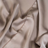 Almond Faux Acetate Satin — mid-weight double-faced polyester satin with a delustered finish, fluid drape and slight stretch