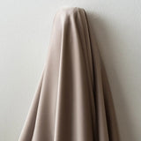Almond Faux Acetate Satin — mid-weight double-faced polyester satin with a delustered finish, fluid drape and slight stretch