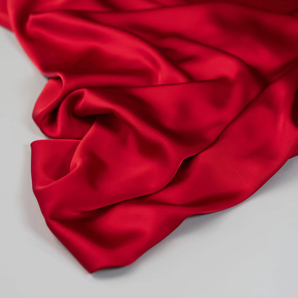 Deep Red Faux Acetate Satin — mid-weight double-faced polyester satin with a delustered finish, fluid drape and slight stretch