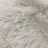 Ostrich feather trim — featuring a soft feather edge with delicate beading, mounted on tulle