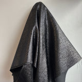 Black Metallic Jacquard — featuring a woven metallic jacquard design with a soft feel and stiff drape, 140cm wide