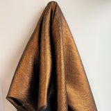 Copper Metallic Jacquard — featuring a woven metallic jacquard design with a soft feel and stiff drape, 140cm wide