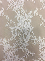 Ivory Fine Chantilly lace — featuring scalloped edges, eyelash detail and floral motifs, in viscose, 135cm wide