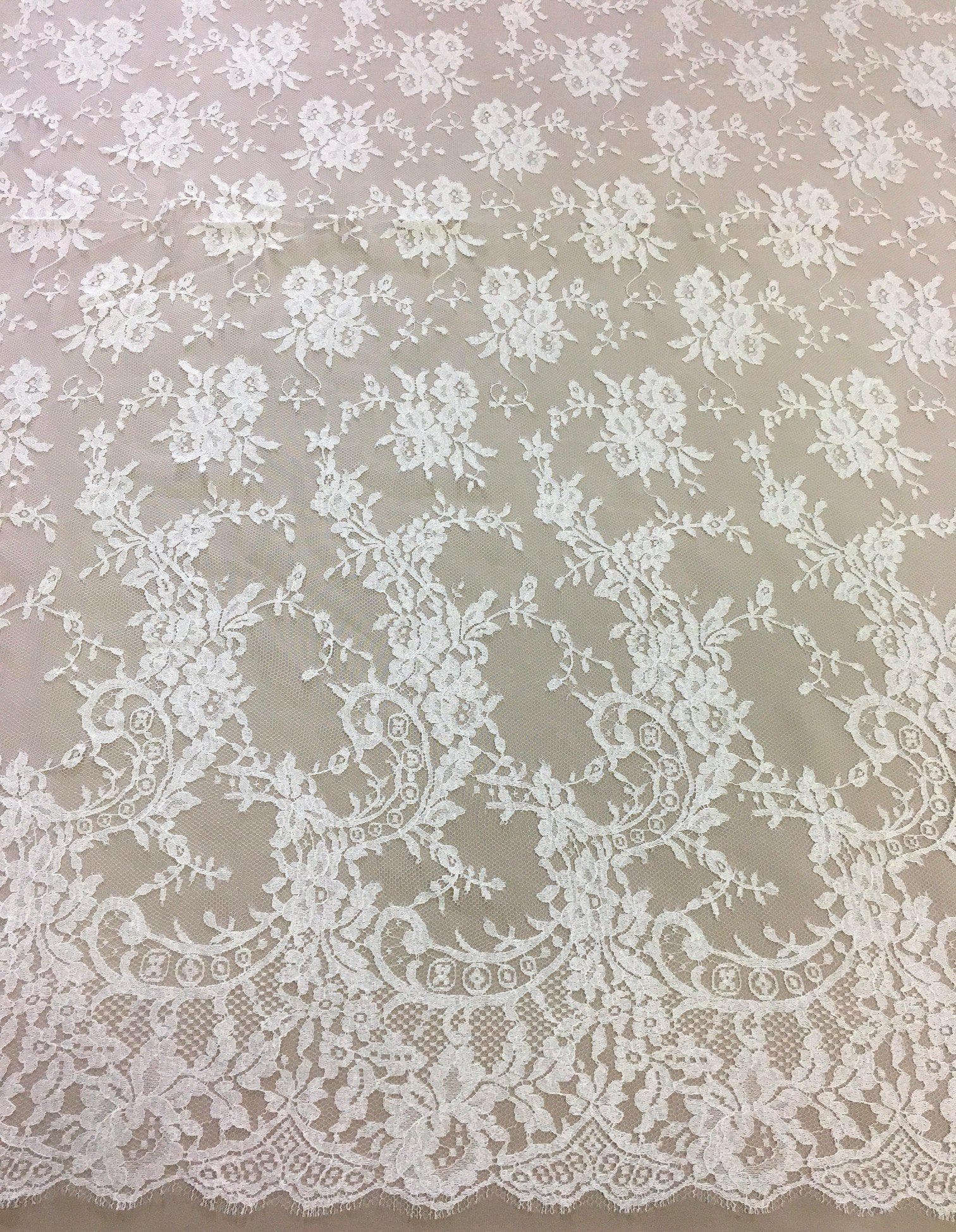 Ivory Fine Chantilly lace — featuring scalloped edges, eyelash detail and floral motifs, in viscose, 135cm wide