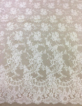 Ivory Fine Chantilly lace — featuring scalloped edges, eyelash detail and floral motifs, in viscose, 135cm wide